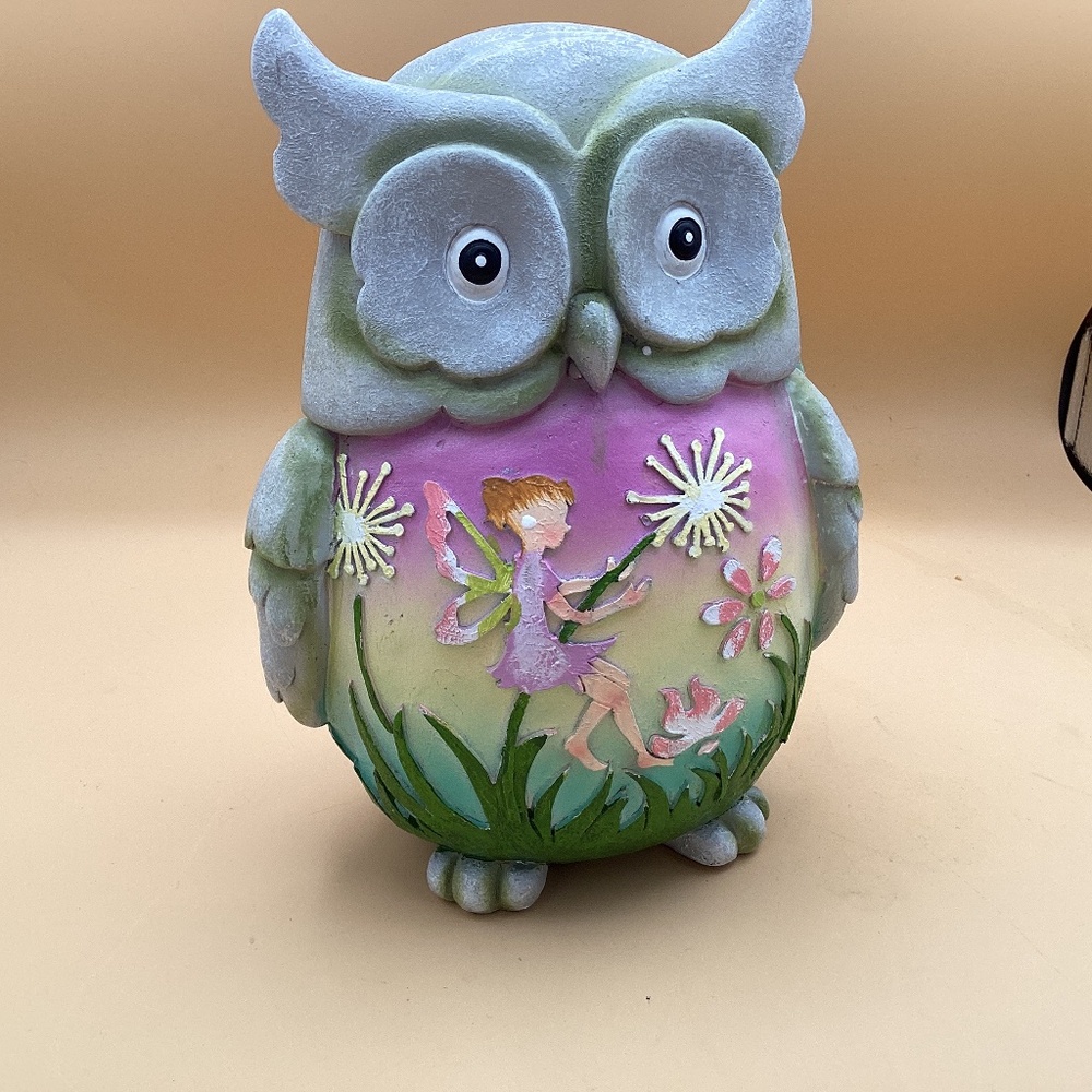 Resin owl with fairy and flowers on front